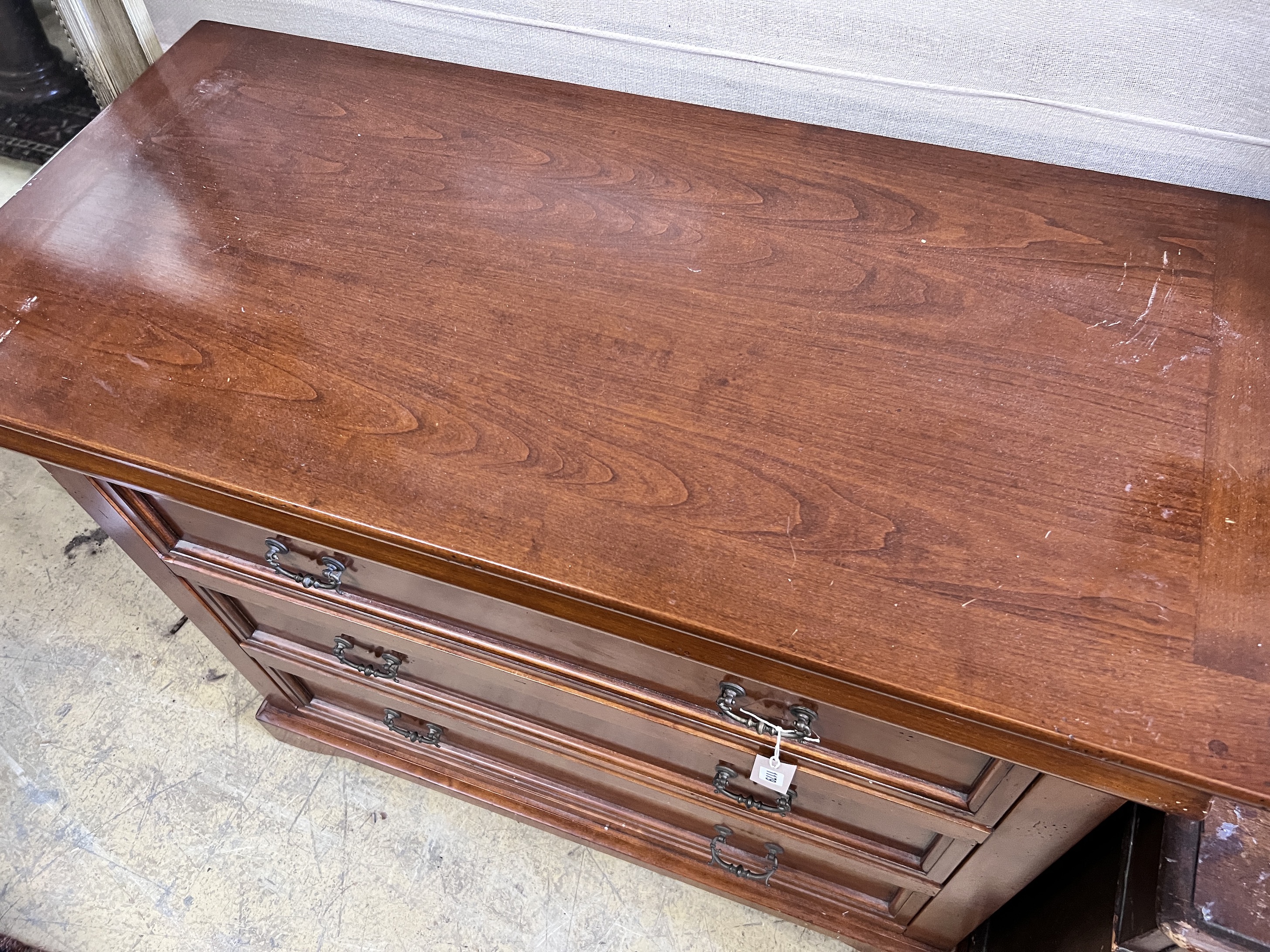 A modern mahogany chest of four long drawers, width 105cm